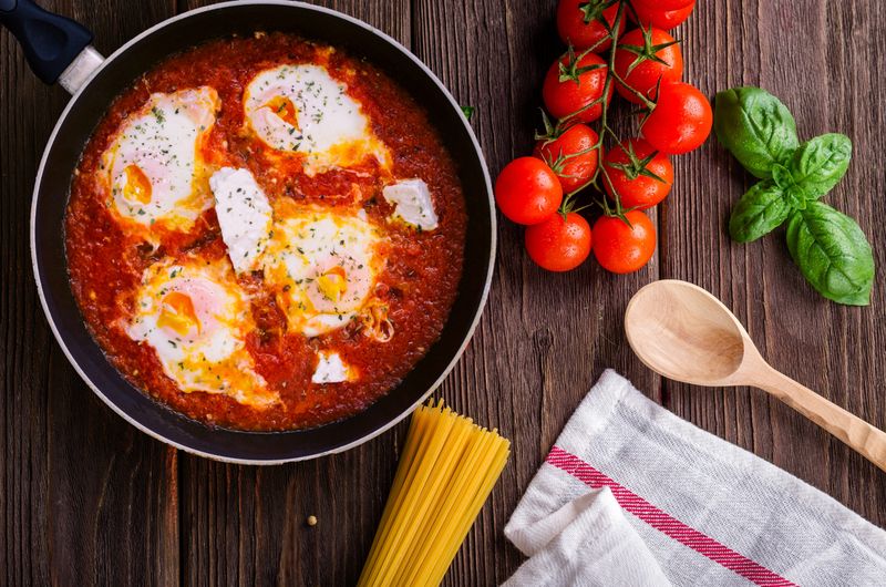 Shakshuka with eggs in spiced tomato sauce